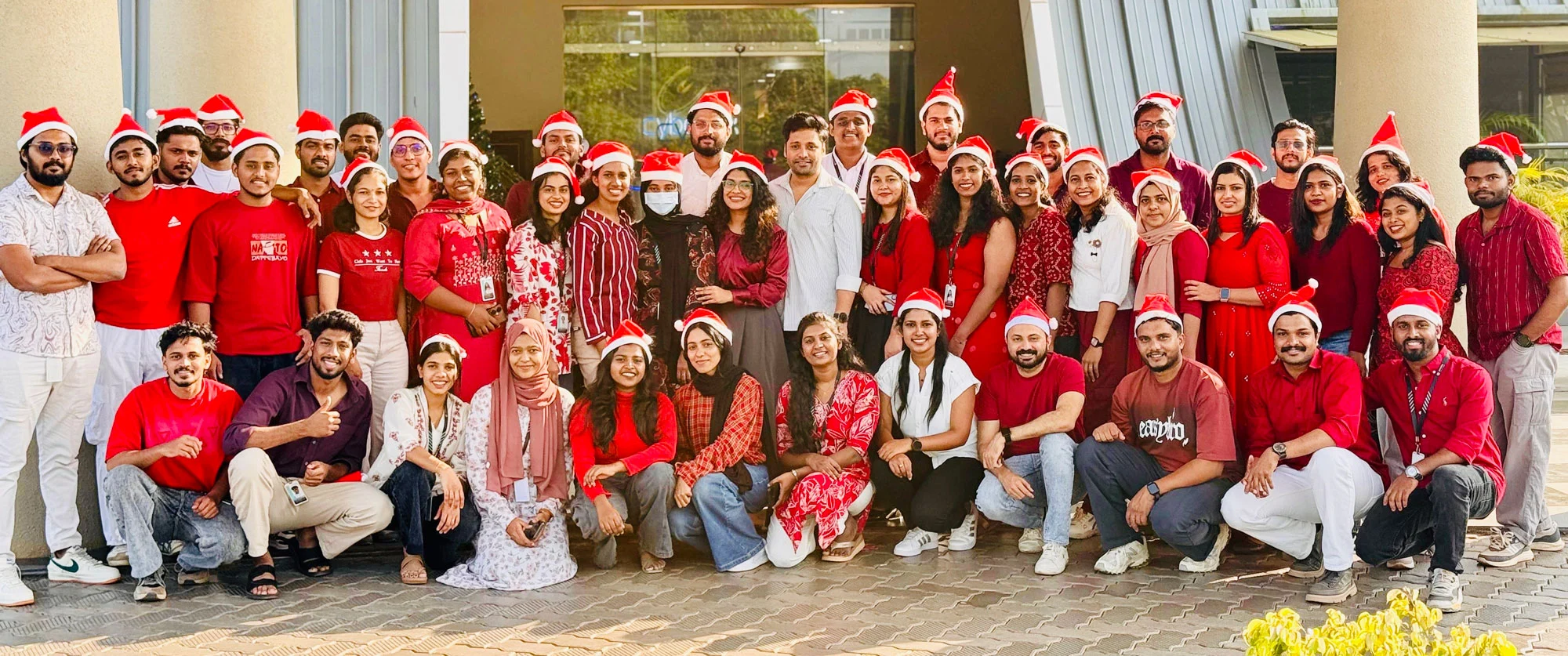 Diverse group of people in various colors and shapes, representing team members of Artifitia Solutions, a software company in Calicut.
